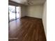 Bright living room features hard flooring and a sliding door leading to the backyard at 4741 W Annette Cir, Glendale, AZ 85308