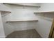 Spacious walk-in closet with multiple shelves providing ample storage at 8444 W Behrend Dr, Peoria, AZ 85382