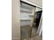 Walk-in closet with mirrored sliding doors and built-in shelving at 8444 W Behrend Dr, Peoria, AZ 85382