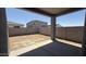 The house backyard patio has a block wall at 11429 E Utah Ave, Mesa, AZ 85212