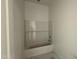 Bathroom with installed white tiled shower-bathtub combo, freshly painted walls ready for personalization at 11429 E Utah Ave, Mesa, AZ 85212