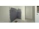 Bathroom with shower stall under construction, featuring gray backer board, and plumbing fixtures at 11429 E Utah Ave, Mesa, AZ 85212