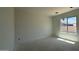 A bedroom with smooth walls ready for paint or wallpaper. Perfect canvas for customization with window view at 11429 E Utah Ave, Mesa, AZ 85212