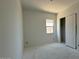 Bedroom with window and sliding door closet at 11429 E Utah Ave, Mesa, AZ 85212