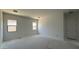 Bedroom with two windows and a door at 11429 E Utah Ave, Mesa, AZ 85212