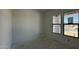A new construction bedroom featuring a pair of windows showing clear blue skies and neighborhood views at 11429 E Utah Ave, Mesa, AZ 85212