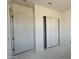 Bedroom featuring standard closet and another standard door, ready for final design choices at 11429 E Utah Ave, Mesa, AZ 85212