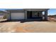 New construction single-Gathering home featuring a two-car garage and covered entry in a developing community at 11429 E Utah Ave, Mesa, AZ 85212
