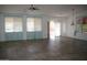 Spacious living room featuring tile flooring, large windows, and neutral paint, ready for your personal touch at 2123 W Maldonado Rd, Phoenix, AZ 85041