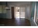 Bright living space with tile floors, decorative lighting, and sliding glass doors to access the backyard at 2123 W Maldonado Rd, Phoenix, AZ 85041