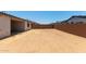 Large backyard with privacy wall offers a flexible space for outdoor activities and landscaping at 23724 N 165Th Dr, Surprise, AZ 85387