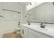 Bright bathroom with double sinks, modern fixtures, and tub/shower with white tile at 23724 N 165Th Dr, Surprise, AZ 85387