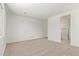A spacious bedroom featuring carpet flooring, neutral paint, and multiple windows for natural light at 23724 N 165Th Dr, Surprise, AZ 85387