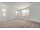 Spacious bedroom with carpet, neutral paint and large windows for natural light at 23724 N 165Th Dr, Surprise, AZ 85387