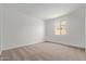 Bright, carpeted bedroom with a window letting in natural light for a calm, peaceful space at 23724 N 165Th Dr, Surprise, AZ 85387