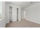 Bedroom with a closet featuring white doors and neutral colored carpet at 23724 N 165Th Dr, Surprise, AZ 85387