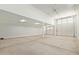 A large two-car garage offers generous space with bright lighting and clean, white walls at 23724 N 165Th Dr, Surprise, AZ 85387