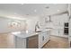 Well-equipped kitchen with stainless steel appliances, a large island, and ample cabinet space in a modern design at 23724 N 165Th Dr, Surprise, AZ 85387