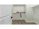 Spacious walk-in closet with wooden shelves and neutral carpet offers plenty of storage at 23724 N 165Th Dr, Surprise, AZ 85387