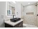 Bathroom showcasing a vessel sink, geometric tile, a lighted mirror and a luxurious shower at 4316 N 86Th Pl, Scottsdale, AZ 85251