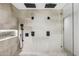 Spa-like bathroom with dual rain shower heads and sleek, minimalist design at 4316 N 86Th Pl, Scottsdale, AZ 85251