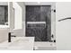 Contemporary bathroom with elegant marble backsplash, sleek fixtures, and glass shower door at 4316 N 86Th Pl, Scottsdale, AZ 85251