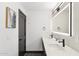 Modern bathroom with dual sinks, granite countertops, and stylish mirrors at 4316 N 86Th Pl, Scottsdale, AZ 85251