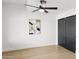 Bedroom with ceiling fan, modern art, and a sliding-door closet at 4316 N 86Th Pl, Scottsdale, AZ 85251