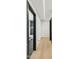 Hallway leading to a stylish bathroom with modern fixtures at 4316 N 86Th Pl, Scottsdale, AZ 85251
