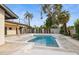 Backyard oasis with a modern pool, lush landscaping, and a contemporary outdoor living space at 4316 N 86Th Pl, Scottsdale, AZ 85251