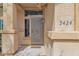 Inviting front door with security screen and covered porch at 5424 S 15Th St, Phoenix, AZ 85040
