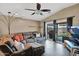 Comfortable living room with plush sofa, ceiling fan, and sliding doors to backyard, perfect for entertaining at 5424 S 15Th St, Phoenix, AZ 85040