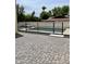 Backyard pool area enclosed by a black fence and adorned with pavers, offering privacy and a luxurious outdoor experience at 707 E Ocotillo Rd, Phoenix, AZ 85014