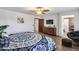 Bedroom featuring wood floors, a decorative bed, and closet at 8246 W Melinda Ln, Peoria, AZ 85382