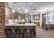 Spacious kitchen featuring a large island with seating, granite countertops, and custom cabinetry at 8246 W Melinda Ln, Peoria, AZ 85382
