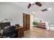 Bright home office featuring wood floors, a storage closet, and ample lighting at 8246 W Melinda Ln, Peoria, AZ 85382