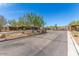 Well-maintained entrance with landscaping and decorative stone features at 3038 W Woburn Ln, Phoenix, AZ 85085