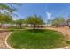 Community park with green grass, shade trees, and recreation areas at 3038 W Woburn Ln, Phoenix, AZ 85085