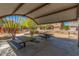 Shaded picnic area with metal tables and benches in a community space at 3038 W Woburn Ln, Phoenix, AZ 85085