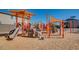 Community playground area with slides, climbing structures, and sun shades at 3038 W Woburn Ln, Phoenix, AZ 85085