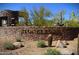 Stone sign reading 'Stoneledge' with desert plants and natural surroundings at 3038 W Woburn Ln, Phoenix, AZ 85085