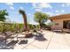 Relaxing backyard patio with a cozy fire pit, comfortable seating, and beautifully landscaped surroundings at 7723 E Visao Dr, Scottsdale, AZ 85266