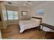 Bright bedroom with wood floors, neutral walls, and a comfortable bed for a relaxing retreat at 7723 E Visao Dr, Scottsdale, AZ 85266