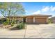 Charming single-story home featuring a two-car garage and desert landscaping at 7723 E Visao Dr, Scottsdale, AZ 85266