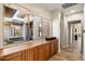 Hallway with tile flooring and a large window to the exterior courtyard at 7723 E Visao Dr, Scottsdale, AZ 85266