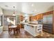 Bright kitchen featuring stainless steel appliances, wood cabinets, and a breakfast nook at 7723 E Visao Dr, Scottsdale, AZ 85266