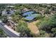 Aerial view of well-maintained community tennis and pickleball courts surrounded by mature desert landscaping at 7723 E Visao Dr, Scottsdale, AZ 85266