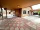 Backyard featuring a spacious tiled patio area, a covered carport, and backyard access at 10223 N 40Th Ave, Phoenix, AZ 85051