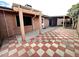 Backyard featuring a tiled patio area, a covered carport, and backyard access at 10223 N 40Th Ave, Phoenix, AZ 85051