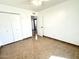 Bright bedroom featuring tiled flooring, closet and views to the hallway at 10223 N 40Th Ave, Phoenix, AZ 85051
